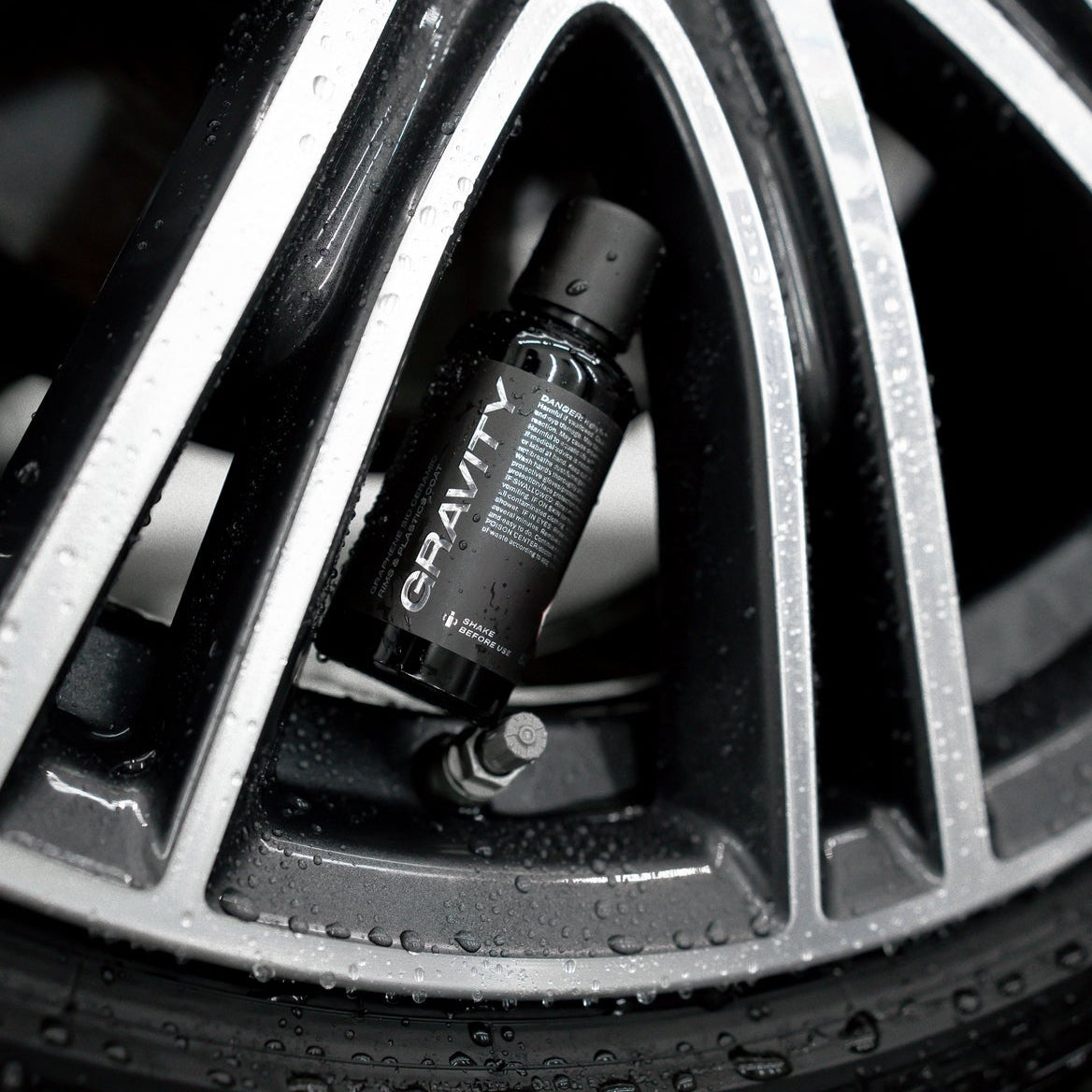 ULTRACOAT Gravity bottle displayed inside an alloy wheel