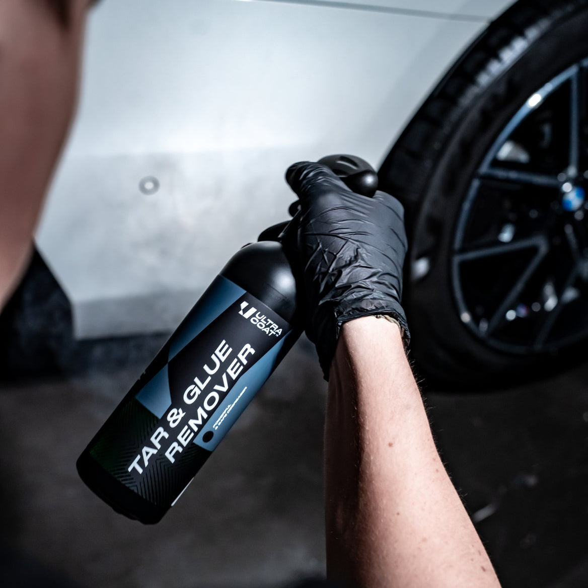 ULTRACOAT Tar & Glue Remover bottle beside a vehicle wheel