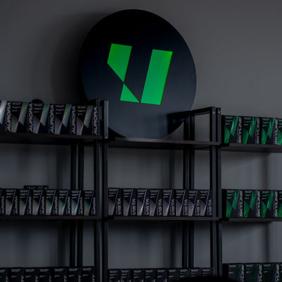 Illuminated ULTRACOAT emblem above a product display