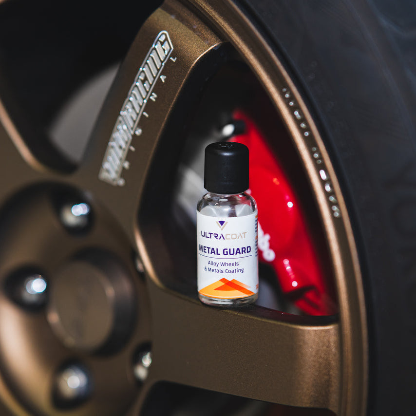ULTRACOAT Metal Guard bottle inside a wheel beside the brake caliper